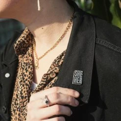 Autostraddle She/Her Pronoun Pin New Merch